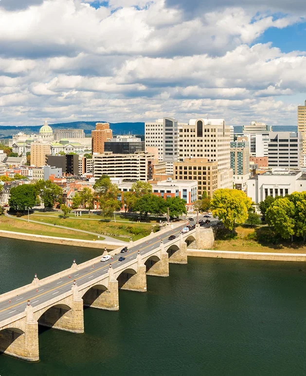 Aerial view of the Harrisburg, Pennsylvania skyline and the stone arch Market Street Bridge over the Susquehanna River